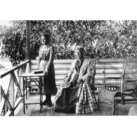 Sitting on the verandah of a Townsville home, ca.1900 