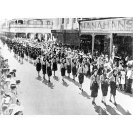 Rangers and Girl Guides marching in Flinders Street during the Anzac Day procession, Townsville, 25th April, 1950. 