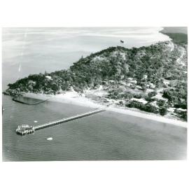 Picnic Bay, showing jetty and swimming enclosure, aerial view. 