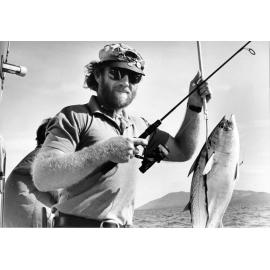 Film maker Mal Florence with a mac-tuna caught on two kilo tackle in the Palm Island Group. 