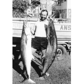 Trevor Fuller holding two 33 kg Spaniards caught at the Palms, Townsville, ca.1988. 