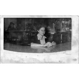 Mrs Mavis Kemp, working at the bar of the Palace Hotel, Flinders Street, Townsville City, Townsville, 1956