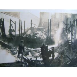 [Fire damage to the Cummins and Campbell building, Flinders Street, Townsville, late 1920's.] 