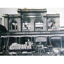 [Fire damage to the Cummins and Campbell building, Flinders Street, Townsville, late 1920's.] 