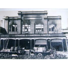[Fire damage to the Cummins and Campbell building, Flinders Street, Townsville, late 1920's.] 