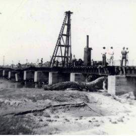 [Rooney's Railway Bridge, Townsville, under repair after the flood of 9th March, 1946] 