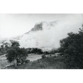 Firefighters attending the fire at the Endeavour Foundation workshop, Landsborough Street, North Ward, Townsville, 27th May, 1974