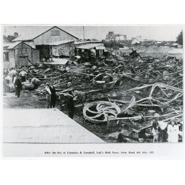 After the fire at Cummins and Campbell Ltd.'s bulk store, Jetty Road, Townsville, 9th July 1932