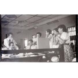 Staff at Samuel Allen's listening to the Melbourne cup, Townsville, 1955