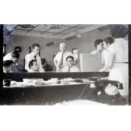 Staff at Samuel Allen's listening to the Melbourne cup, Townsville, 1955