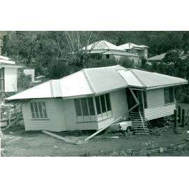 [House and car damaged by Cyclone Althea, Townsville, 1971] 