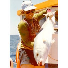 Debbie Giles, a Townsville High School teacher, shows off her catch on a reef trip, Townsville, 1979. 