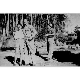 Paluma, U.S. soldier convalescing with local friend with logging in the background, ca 1942 