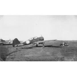 CW22 Wacket Trainer aircraft in airfield, ca 1940 
