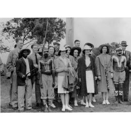 Jack Woodward's party, with a group of Aborigines at Palm Island, ca 1940 