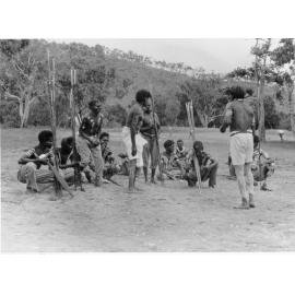 Aborigines preparing to perform a corroboree at Palm Island, ca 1940