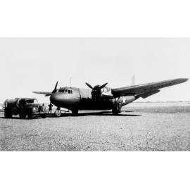 DC5 aircraft with truck in an airfield, ca 1940 