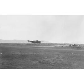 Lockheed Hudson aircraft leaving airfield at Garbutt, Townsville, ca 1940 