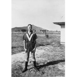 Man in Townsville military (airforce) sports uniform, with playing field in background, ca 1940