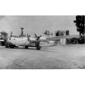 Aircraft, Liberator B24, with truck, on landing strip, ca 1940 