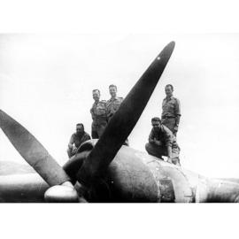 Jim Darmody, Ted Bevin, Phil Mathiesen, Bert Ogden, Bryan Fox standing on wing of Catalina aircraft, 1944 