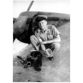Phil Mathiesen on Catalina aircraft with blown piston, ca 1940 
