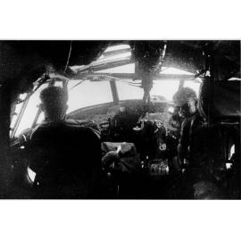Mason and Stevie White in cockpit of aircraft, ca 1940 
