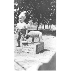 Ernie Kelso with dog, Laudham Park, ca 1918 