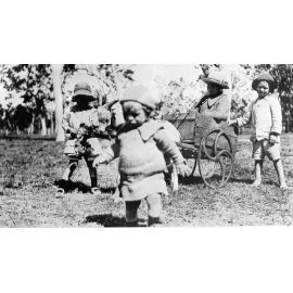 Ruth Kelso in billy goat cart, with Ethel Kelso holding stick horse and Ernie Kelso holding reins, 1917 