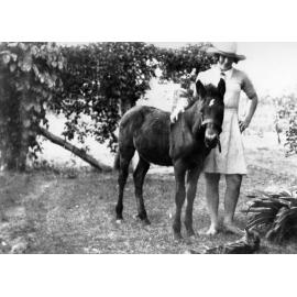 Doris Kelso with pony foal and cat at Laudham Park, ca 1930 