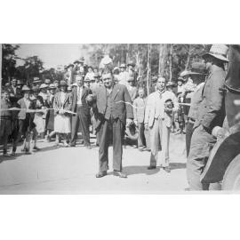 Mount Spec, The Hon. C. G. "Nugget" Jesson cuts the ribbon to officially open Mount Spec Road, 18 July 1937 