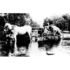 Jack Hood delivering fruit and vegetables during construction of Mount Spec Road, ca 1930 