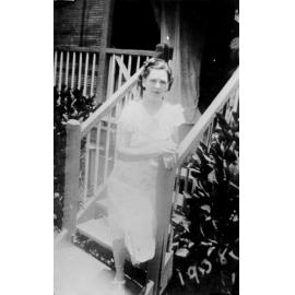 Marg Patterson on steps of house at Laudham Park, ca 1938 