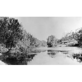 Ross River, with boat on bank, ca 1940