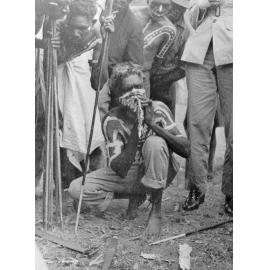 Palm Island, an aboriginal making fire, ca 1940 