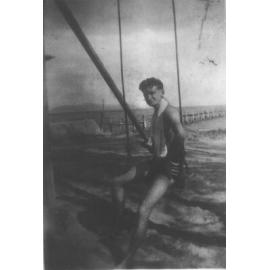 Percy Menery at the beach on a swing, n.d. 