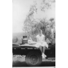 Maureen McIntosh sitting in back of 'Bedford', belonging to Les Field, ca 1948 