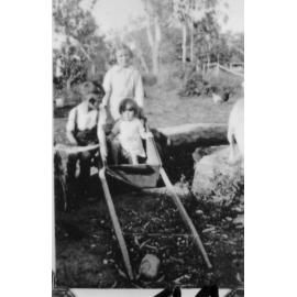 Pat, Frank and Maureen Neville in a goat cart, Manton, 1936 