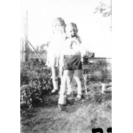 Pat and Frank Neville in garden, Manton, ca 1934 