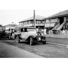 Kenneth McKergow leaning against Whippet after 1946 flood, Railway Estate, 1946 