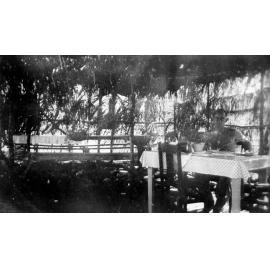 Magnetic Island, Don Carr taking refreshments in a tea house near Horseshoe Bay, 1944 