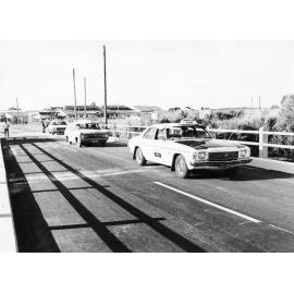 The first cars to cross the newly widened Rooney's bridge, Townsville 