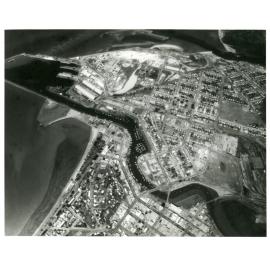 Oblique aerial view of South Townsville, the harbour, city area and the Strand, 1976