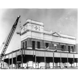 Demolition of the old Townsville ambulance station, corner of Sturt and Stanley Streets, Townsville City, Townsville, 9 September 1968