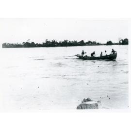 Men in a boat on the flooded Burdekin River, Ayr, 1917