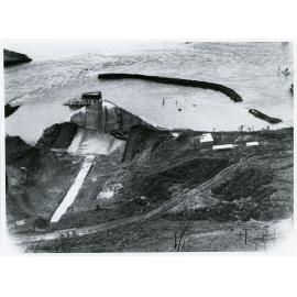 Flood waters, Ross River, over the partially completed Five Head Creek dam, Townsville, 10 January 1972