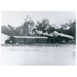 Train no.14, "Pony Express", 13 down, being pulled from the flooded Burdekin River railway bridge by the Pioneer Sugar Mill loco, 7th April, 1922