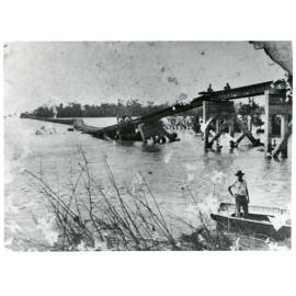 View of the flood damaged Burdekin River railway bridge as flood waters receded, 1922