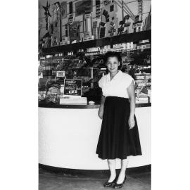 Dorothy Chun Tie (nee Huen) at the front of the milk bar, Townsville, 1953