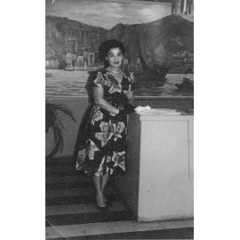 Dorothy Chun Tie in the dining room of the renovated restaurant in front of the Hong Kong harbour mural, Townsville, 1963